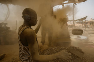 Gold prospectors at work in the Delgo gold market in the Sahara, Sudan