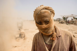 Gold prospectors at work in the Delgo gold market in the Sahara, Sudan