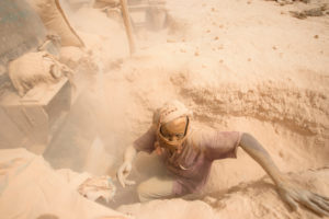 Gold prospectors at work in the Delgo gold market in the Sahara, Sudan