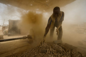 Gold prospectors at work in the Delgo gold market in the Sahara, Sudan