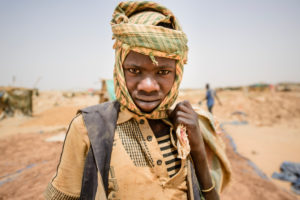 Gold prospectors at work in the Delgo gold market in the Sahara, Sudan