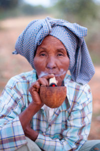 Old Burmese woman smoking in Bagan, Myanmar Old Burmese woman smoking in Bagan, Myanmar