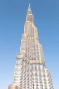 Dubai, Burj Khalifa shining golden during sunset
