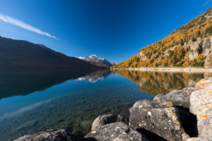 A cloudless autumn day starts at Lake Silvaplana in the Engadin, canton of Grisons, Switzerland A cloudless autumn day starts at Lake Silvaplana in the Engadin, canton of Grisons, Switzerland