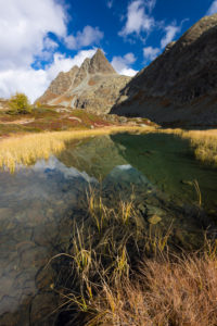 Autumn at 2300 meters above sea level at the Crap Alv Laiets on the Albula Pass, canton of Grisons, Switzerland Autumn at 2300 meters above sea level at the Crap Alv Laiets on the Albula Pass, canton of Grisons, Switzerland