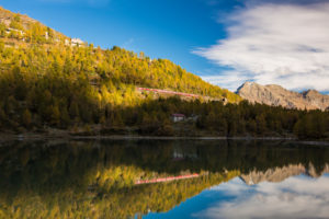 Light and shade determine the autumnal landscape on Lake Palü in the Alp Grüm, canton of Grisons, Switzerland Light and shade determine the autumnal landscape on Lake Palü in the Alp Grüm, canton of Grisons, Switzerland