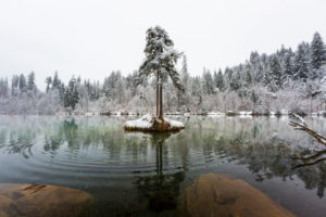 The first snow in November covers Lake Cresta near Trin with a winter dress, Canton Grisons, Switzerland The first snow in November covers Lake Cresta near Trin with a winter dress, Canton Grisons, Switzerland