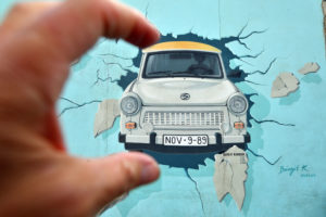 Germany, Berlin, Friedrichshain-Kreuzberg, East Side Gallery, The Wall, work by Birgit Kinder dating from the 1990's, renovated in 2009, representing a Trabant arriving in East Berlin, entitled Test the Best Germany, Berlin, Friedrichshain-Kreuzberg, East Side Gallery, The Wall, work by Birgit Kinder dating from the 1990's, renovated in 2009, representing a Trabant arriving in East Berlin, entitled Test the Best