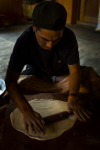 People on the Markha Valley Trek, man cooking People on the Markha Valley Trek, man cooking
