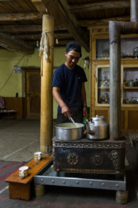 People on the Markha Valley Trek, man cooking People on the Markha Valley Trek, man cooking