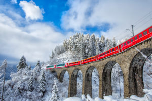 Bernina Express passes through the snowy woods around Filisur Canton of Grisons Switzerland Europe, Schmittner Viadukt Bernina Express passes through the snowy woods around Filisur Canton of Grisons Switzerland Europe, Schmittner Viadukt