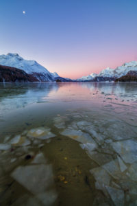 Sheets of ice on the surface of Lake Sils in a cold winter morning at dawn Upper Engadine Canton of Graubunden Switzerland Europe Sheets of ice on the surface of Lake Sils in a cold winter morning at dawn Upper Engadine Canton of Graubunden Switzerland Europe