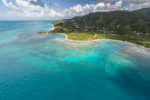 Aerial view of the turquoise caribbean sea and vegetation on the isle of Antigua Leeward Islands West Indies Aerial view of the turquoise caribbean sea and vegetation on the isle of Antigua Leeward Islands West Indies