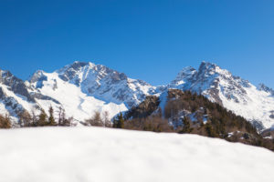 The snowy peak of Mount Disgrazia framed by blue sky Alpe Granda Sondrio province Masino Valley Valtellina Lombardy Italy Europe The snowy peak of Mount Disgrazia framed by blue sky Alpe Granda Sondrio province Masino Valley Valtellina Lombardy Italy Europe