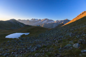 Meadows and lake around Cima Presanella seen from Monte Tonale Valcamonica border Lombardy and Trentino Alto Adige Italy Europe Meadows and lake around Cima Presanella seen from Monte Tonale Valcamonica border Lombardy and Trentino Alto Adige Italy Europe