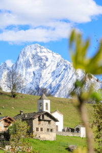 Alpine church framed by the snowy peak of Pizzo di Prata in spring Daloo Chiavenna Valley Valtellina Lombardy Italy Europe Alpine church framed by the snowy peak of Pizzo di Prata in spring Daloo Chiavenna Valley Valtellina Lombardy Italy Europe