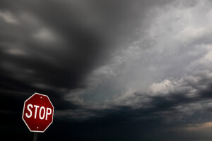 Dark storm clouds over a stop sign,Badlands National Park,South Dakota,USA. 2022. 