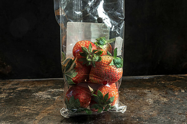strawberrys packed in non-biodegradable plastics strawberrys packed in non-biodegradable plastics