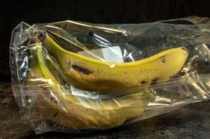 banana packed in non-biodegradable plastics banana packed in non-biodegradable plastics