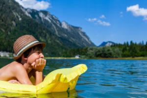 Boy, air mattress, lake, child, mountain Boy, air mattress, lake, child, mountain