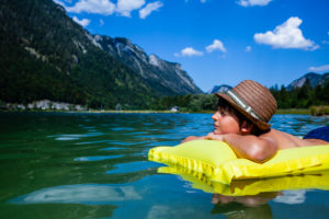 Boy, air mattress, lake, child, mountain Boy, air mattress, lake, child, mountain