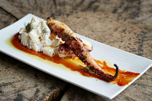 Fried octopus served with potato salad