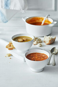 Tomato and bean soup, and chickpea soup in soup bowls