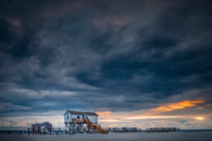 Germany, Schleswig-Holstein, Sankt Peter-Ording, beach, pole, buildings on stilts Germany, Schleswig-Holstein, Sankt Peter-Ording, beach, pole, buildings on stilts