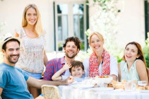 Friends enjoying meal together outdoors