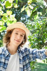 Young man wearing sun hat, portrait