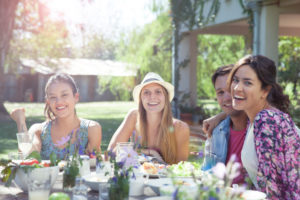 Friends bonding during weekend meal together, portrait