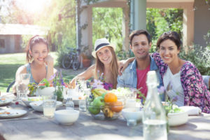 Friends having meal together, portrait