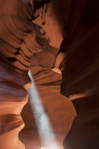 Beam of sunlight shining into Antelope Canyon, Arizona, USA