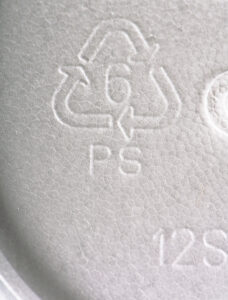 Styrofoam or polystyrene cup showing the recycling symbol on the bottom. 