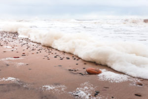 Water washed stone on beach near Hvide Sande Water washed stone on beach near Hvide Sande