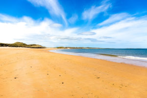 The beach at Dunstanburg Castle in Northumberland, England The beach at Dunstanburg Castle in Northumberland, England