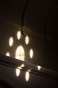Europe, Germany, Lower Saxony, Delmenhorst. Through the window rose, inspired by churches, sunlight shines into the hall of the turbine house of the Norddeutsche Wollkämmerei and Kammgarnspinnerei (Nordwolle). Europe, Germany, Lower Saxony, Delmenhorst. Through the window rose, inspired by churches, sunlight shines into the hall of the turbine house of the Norddeutsche Wollkämmerei and Kammgarnspinnerei (Nordwolle).