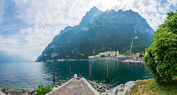Bildagentur | mauritius images | Woman on waterfront in Riva del Garda,  Italy