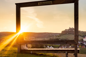 Falkenstein, Picture Frame, sunset, woman sitting at bench, Falkenstein castle, blooming fruit trees, church Falkenstein in Weinviertel region, Lower Austria, Austria Falkenstein, Picture Frame, sunset, woman sitting at bench, Falkenstein castle, blooming fruit trees, church Falkenstein in Weinviertel region, Lower Austria, Austria