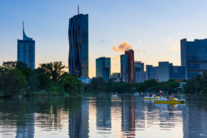 Wien / Vienna, lake Kaiserwasser, Donaucity with highrise Hochhaus Neue Donau, DC Tower 1, UN building UNO, boat in 22. Donaustadt, Vienna, Austria Wien / Vienna, lake Kaiserwasser, Donaucity with highrise Hochhaus Neue Donau, DC Tower 1, UN building UNO, boat in 22. Donaustadt, Vienna, Austria