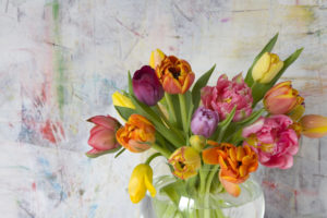Coloured tulip bouquet in glass vase Coloured tulip bouquet in glass vase