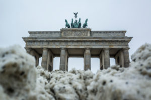 Brandenburg Gate behind snow pile, Mitte, Berlin Brandenburg Gate behind snow pile, Mitte, Berlin
