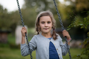 Girl on a swing in the garden Girl on a swing in the garden