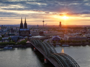 Deep view, office building, cathedral, church towers, transmission tower, bridge. Skyscraper, river, river, boats, ships, shore, bank edge, dusk, evening mood Deep view, office building, cathedral, church towers, transmission tower, bridge. Skyscraper, river, river, boats, ships, shore, bank edge, dusk, evening mood