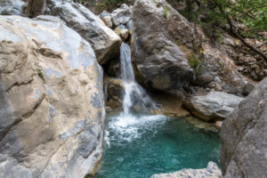 Water basin with turquoise clear water on the Samaria Gorge hike, West Crete, Greece Water basin with turquoise clear water on the Samaria Gorge hike, West Crete, Greece