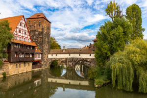 View from Maxbrücke to the Pegnitz (river) and the Henkerbrücke with water tower in the afternoon, Nuremberg city center, Franconia, Bavaria, Germany View from Maxbrücke to the Pegnitz (river) and the Henkerbrücke with water tower in the afternoon, Nuremberg city center, Franconia, Bavaria, Germany