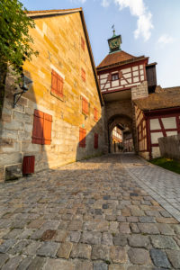 Entrance to the courtyard of Cadolzburg Castle in the late afternoon, Cadolzburg, Franconia, Bavaria, Germany Entrance to the courtyard of Cadolzburg Castle in the late afternoon, Cadolzburg, Franconia, Bavaria, Germany