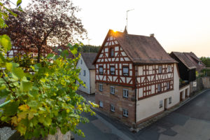 View from the entrance to Cadolzburg Castle on the vine and half-timbered house, Cadolzburg, Franconia, Bavaria, Germany View from the entrance to Cadolzburg Castle on the vine and half-timbered house, Cadolzburg, Franconia, Bavaria, Germany