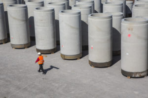 Gelsenkirchen, North Rhine-Westphalia, Germany - Sewer pipes in the concrete plant, in the warehouse sewer pipes are assembled for transport. Gelsenkirchen, North Rhine-Westphalia, Germany - Sewer pipes in the concrete plant, in the warehouse sewer pipes are assembled for transport.