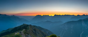 Sunrise over the Karwendel Mountains with a view of the western Karwendelspitze and the Hochkarspitze in Austria. Sunrise over the Karwendel Mountains with a view of the western Karwendelspitze and the Hochkarspitze in Austria.